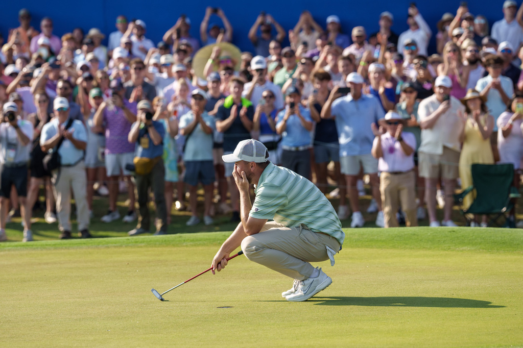 Alex Fitzpatrick, of England, reacts after sinking a birdie putt and winning the tournament with his brother Matt Fitzpatrick during the final round of the PGA Zurich Classic of New Orleans golf tournament, Sunday, April 26, 2026, in Avondale, La. (AP Photo/Matthew Hinton)