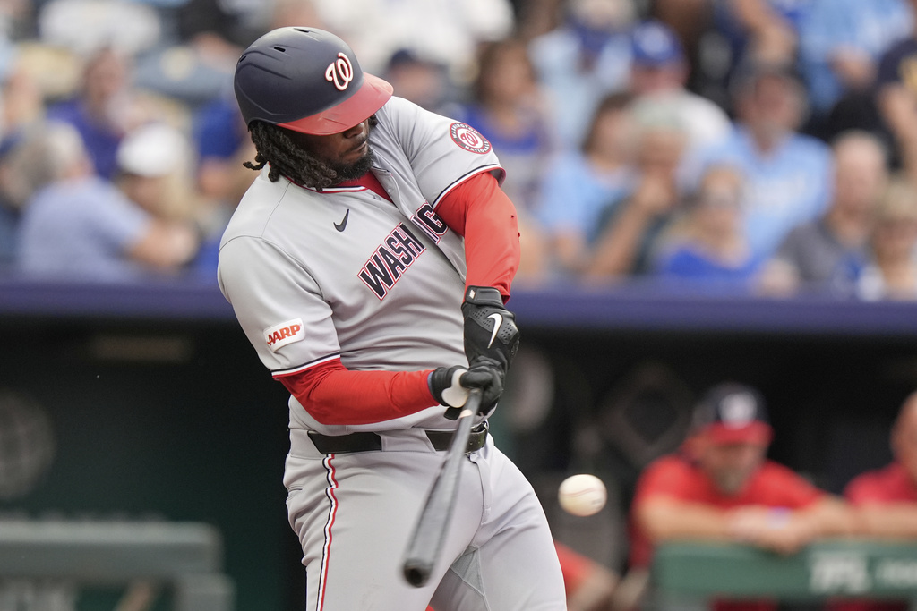 CORRECT NAME TO JOSH BELL NOT JAMES WOOD - Washington Nationals' Josh Bell hits a two-run home run during the first inning of a baseball game against the Kansas City Royals, Monday, Aug. 11, 2025, in Kansas City, Mo. (AP Photo/Charlie Riedel)