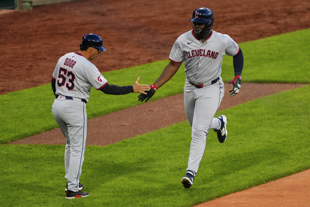 Cleveland Guardians outfielder Jhonkensy Noel, right, is congratulated on his home run by third base coach Rouglas Odor against the Boston Red Sox during the second inning of a baseball game, Tuesday, Sept. 2, 2025, in Boston. (AP Photo/Robert F. Bukaty)