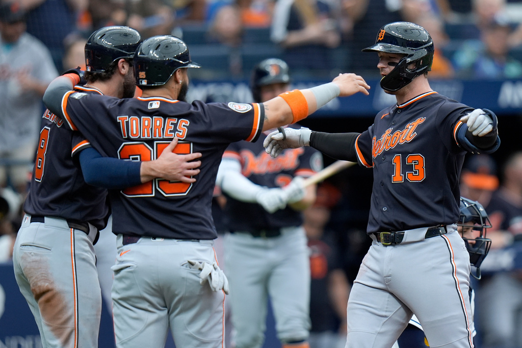 Detroit Tigers' Dillon Dingler (13) celebrates his three-run home run off Tampa Bay Rays pitcher Nick Martinez with Matt Vierling (8) and Gleyber Torres (25) during the fourth inning of a baseball game Wednesday, June 3, 2026, in St. Petersburg, Fla. (AP Photo/Chris O'Meara)