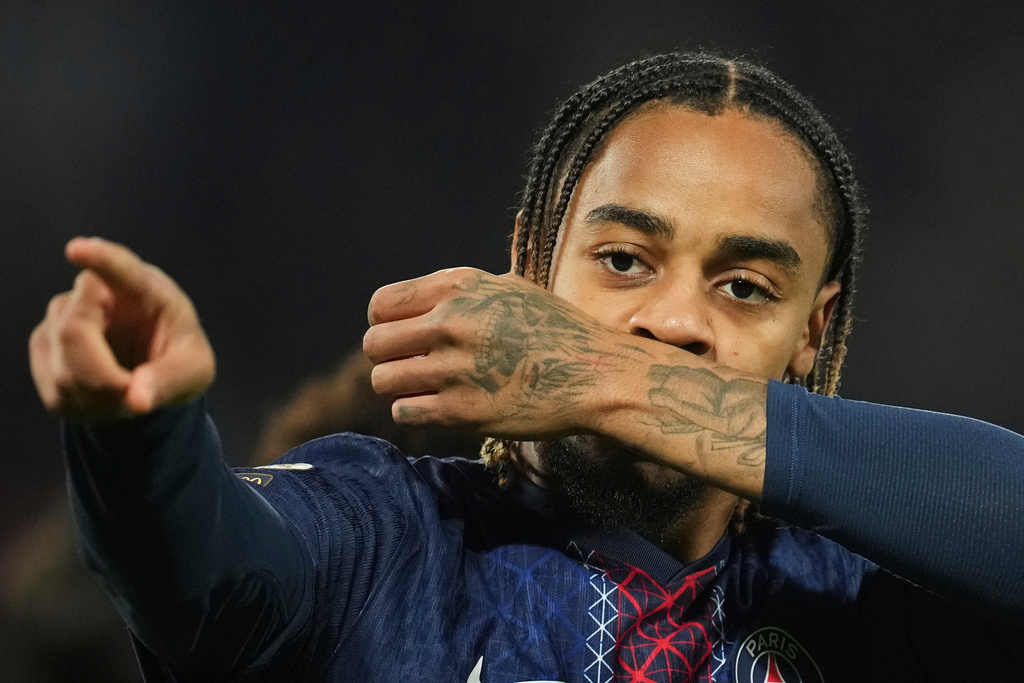 PSG's Bradley Barcola celebrates after scoring the opening goal during the French League One soccer match between Paris Saint-Germain and Strasbourg, in Paris, France, Friday, Oct. 17, 2025. (AP Photo/Christophe Ena)