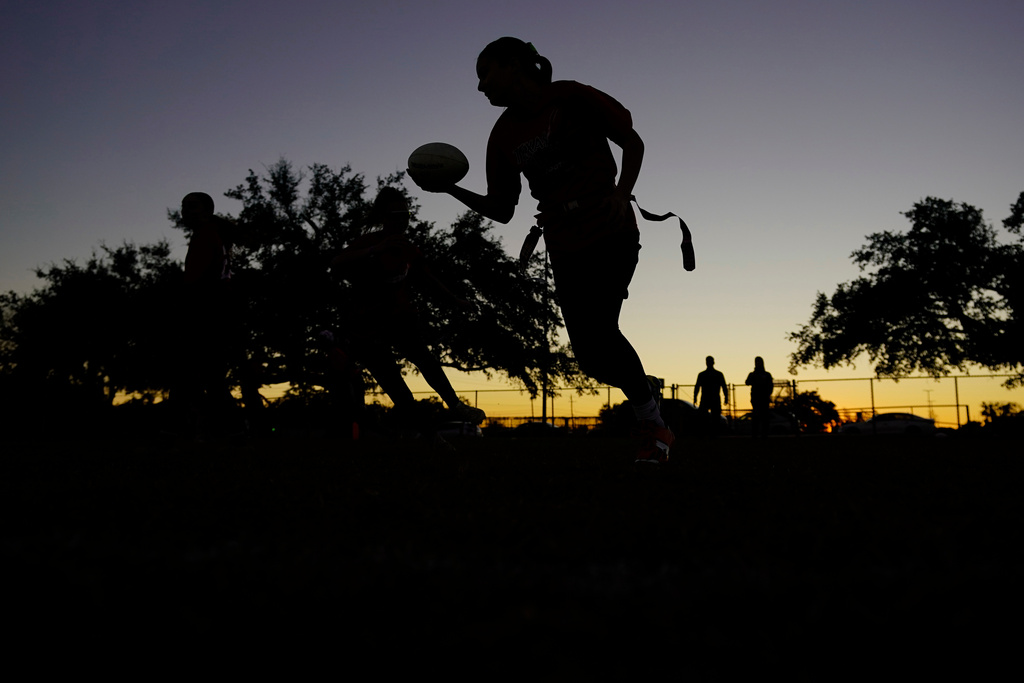 FILE - Players run drills during a practice with Texas Fury, an all-girls flag football select travel team, Dec. 10, 2023, in Austin, Texas. (AP Photo/Eric Gay, File)