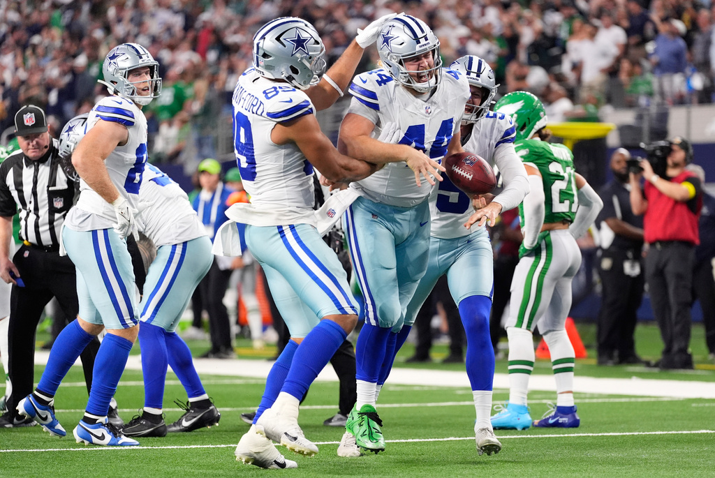 Dallas Cowboys' Trent Sieg (44) celebrates after recovering a fumble on a punt return during the second half of an NFL football game against the Philadelphia Eagles, Sunday, Nov. 23, 2025, in Arlington, Texas. (AP Photo/Tony Gutierrez)