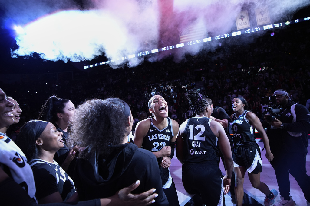 Las Vegas Aces center A'ja Wilson (22) celebrates with teammates after defeating the Seattle Storm in Game 3 in the first round of the WNBA basketball playoffs Thursday, Sept. 18, 2025, in Las Vegas. (AP Photo/John Locher)