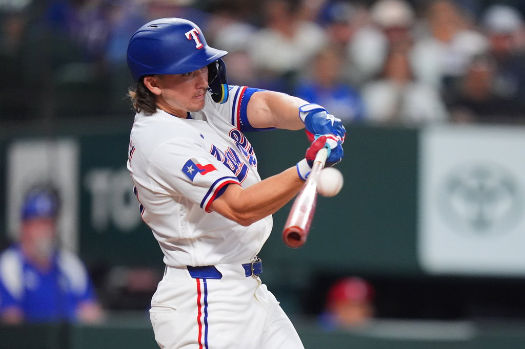 Texas Rangers' Cam Cauley hits a home run during the second inning of a baseball game against the Chicago White Sox, Wednesday, July 22, 2026, in Arlington, Texas. (AP Photo/LM Otero)
