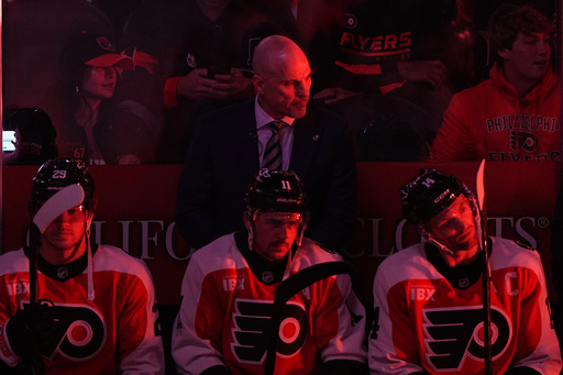 Philadelphia Flyers head coach Rick Tocchet, center top, looks on before an NHL hockey game against the Florida Panthers, Monday, Oct. 13, 2025, in Philadelphia. (AP Photo/Matt Rourke) Philadelphia Flyers head coach Rick Tocchet, center top, looks on before an NHL hockey game against the Florida Panthers, Monday, Oct. 13, 2025, in Philadelphia. (AP Photo/Matt Rourke)