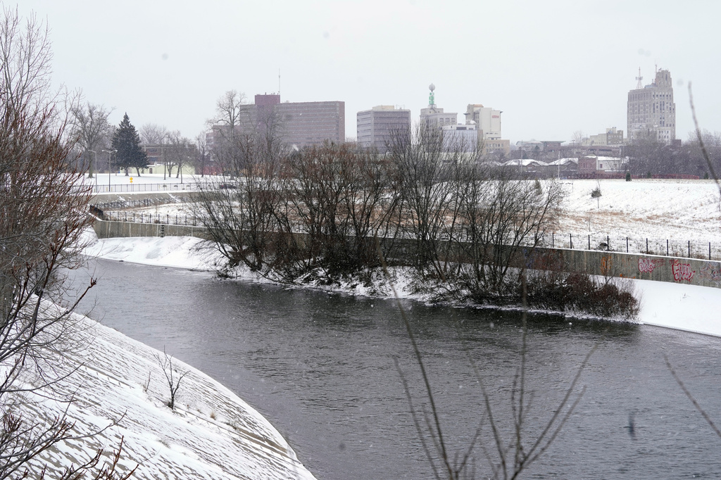 FILE = The Flint River flows Jan. 6, 2022, in Flint, Mich. (AP Photo/Carlos Osorio, File)
