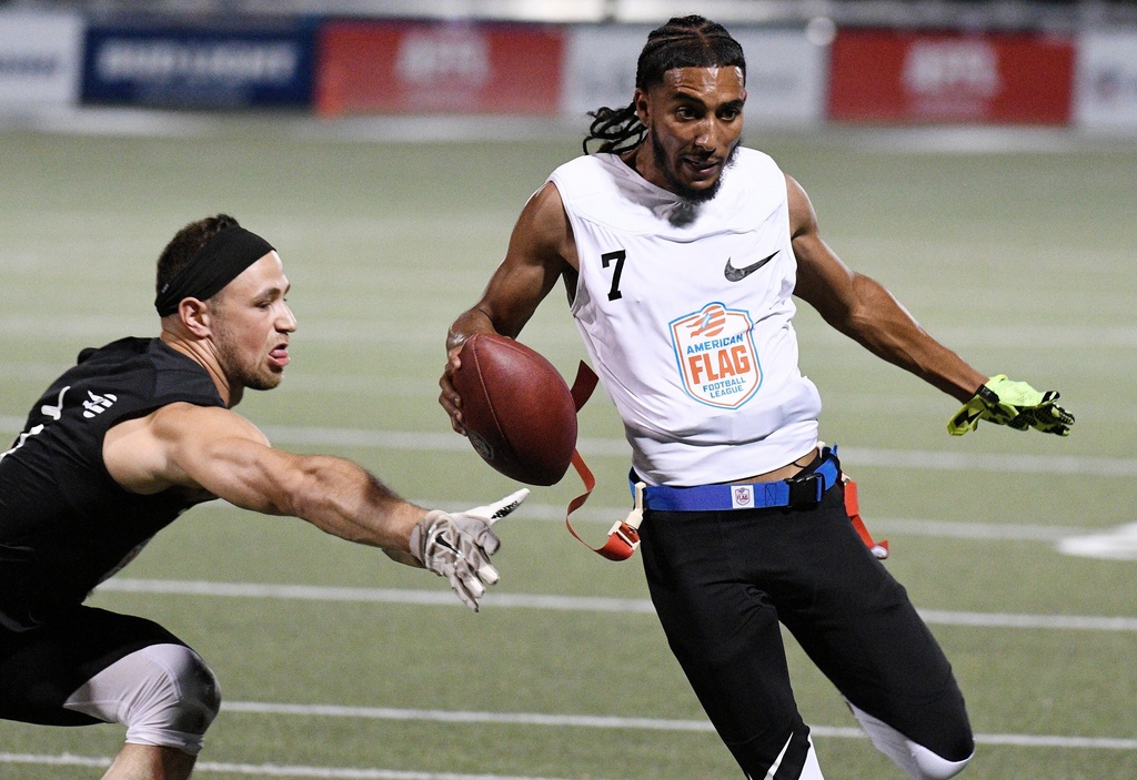 FILE -Fighting Cancer's Darrell Doucette, right, during the American Flag Football League (AFFL) U.S. Open of Football tournament, Saturday, June 30, 2018 in Pittsburgh. (Don Wright/AP Images for American Flag Football League, file)