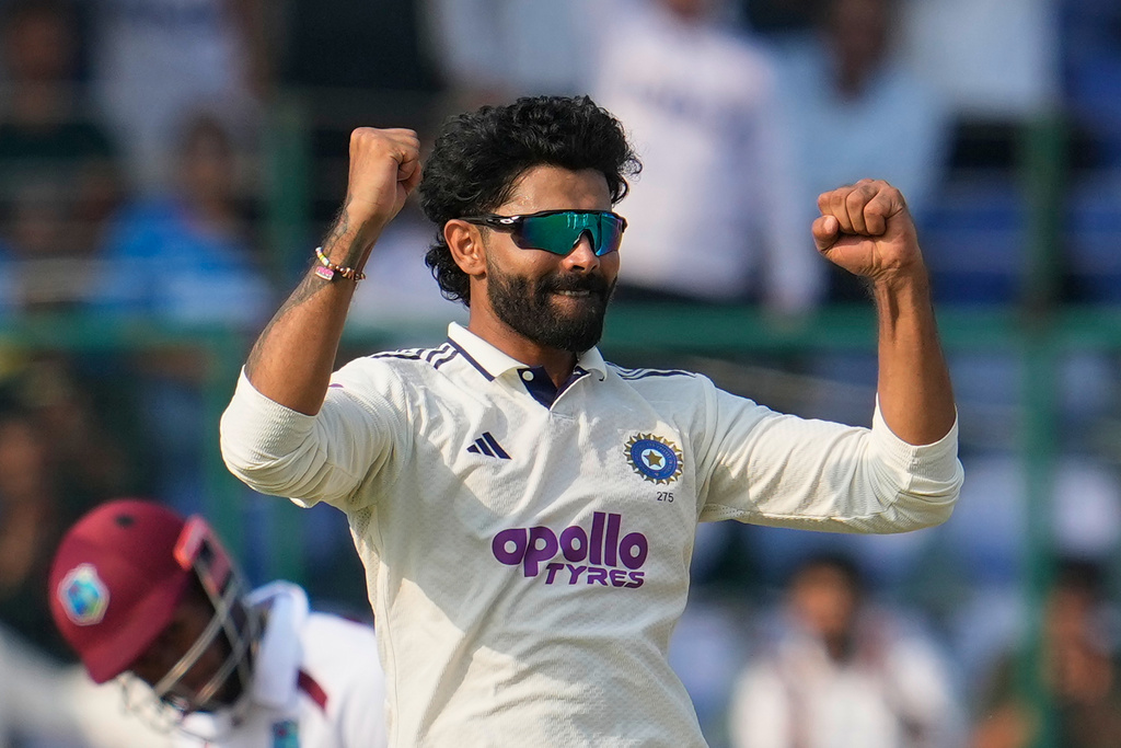 India's Ravindra Jadeja celebrates the dismissal of West Indies' Tagenarine Chanderpaul on the second day of the second cricket test match between India and West Indies at the Arun Jaitley Stadium in New Delhi, India, Saturday, Oct.11, 2025. (AP Photo/Manish Swarup)