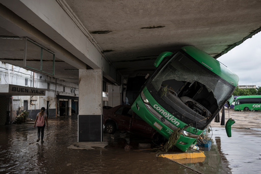 A woman walks through a damaged bus station after heavy rainfall in Poza Rica, Veracruz state, Mexico, Saturday, Oct. 11, 2025. (AP Photo/Felix Marquez) A woman walks through a damaged bus station after heavy rainfall in Poza Rica, Veracruz state, Mexico, Saturday, Oct. 11, 2025. (AP Photo/Felix Marquez)