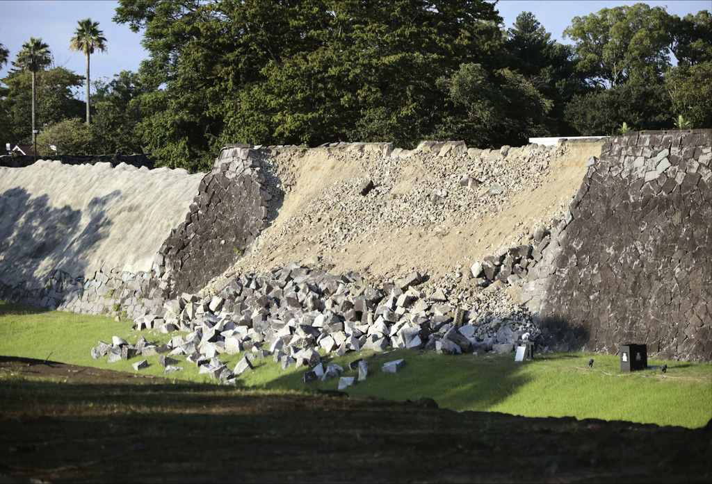 A part of the stone wall of the Kumamoto Castle is seen damaged after an earthquake in Kumamoto in the Kyushu island, southern Japan, Tuesday, July 28, 2026. (Kyodo News via AP)
