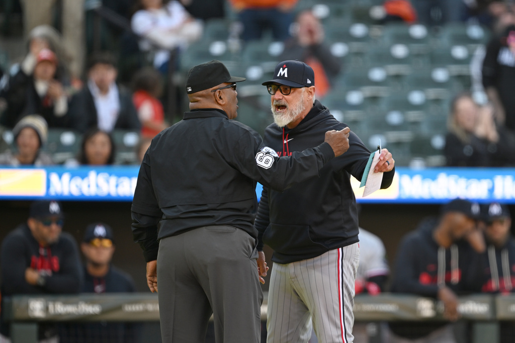 Minnesota Twins manager Derek Shelton argues with umpire Laz Diaz over a pitch challenge during the ninth inning of a baseball game against the Baltimore Orioles, Sunday, March 29, 2026 in Baltimore. (AP Photo/Gail Burton)