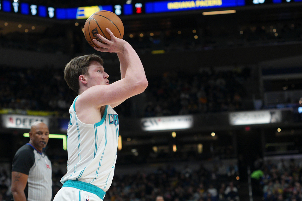 Charlotte Hornets guard Kon Knueppel shoots a 3-point shot against the Indiana Pacers during the first half of an NBA basketball game in Indianapolis, Thursday, Feb. 26, 2026. (AP Photo/AJ Mast)