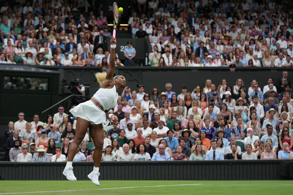 Serena Williams of the United States serves against Maya Joint of Australia in their first round women's singles match at the Wimbledon Tennis Championships in London, Tuesday, June 30, 2026. (AP Photo/Maja Smiejkowska)
