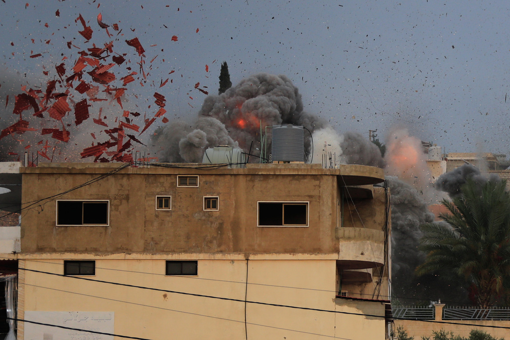 Smoke rises following an Israeli airstrike in the village of Teir Debba, southern Lebanon, Thursday, Nov. 6, 2025. (AP Photo/Mohammad Zaatari)