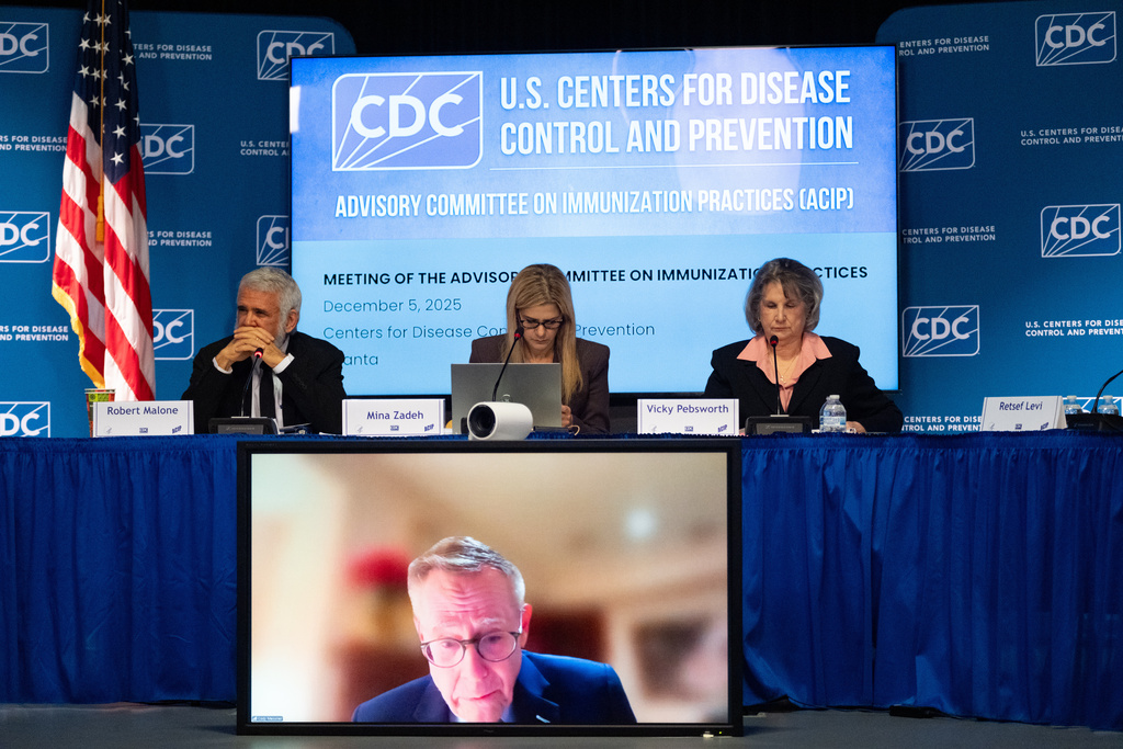 The CDC Advisory Committee on Immunization Practices meets in Atlanta on Friday, Dec. 5, 2025 to consider changes in hepatitis B vaccine recommendations for infants. (AP Photo/Ben Gray)