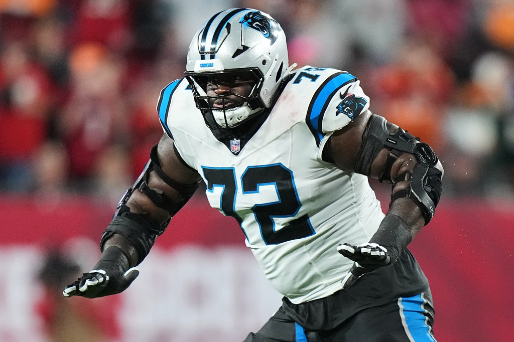 FILE - Carolina Panthers offensive tackle Taylor Moton (72) blocks during an NFL football game against the Tampa Bay Buccaneers, Jan 3, 2026, in Tampa, Fla. (AP Photo/Peter Joneleit, File)