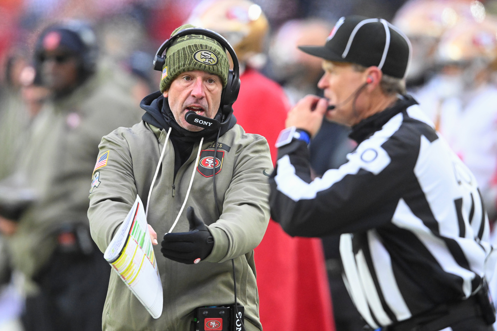 San Francisco 49ers head coach Kyle Shanahan, left, gestures toward an official during the second half of an NFL football game between the Cleveland Browns and the 49ers, Sunday, Nov. 30, 2025, in Cleveland. (AP Photo/David Richard)