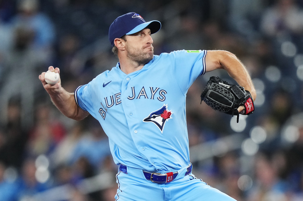 Toronto Blue Jays pitcher Max Scherzer (31) works against the Colorado Rockies during the first inning of a baseball game in Toronto on Tuesday, March 31, 2026. (Nathan Denette/The Canadian Press via AP)