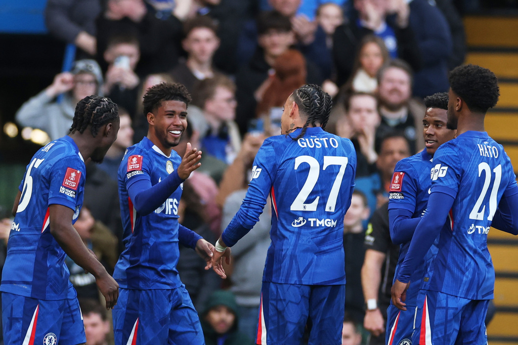 Chelsea's Andrey Santos, second left, celebrates after scoring his side's fifth goal during the English FA Cup quarterfinal soccer match between Chelsea and Port Vale in London, England, Saturday, April 4, 2026. (AP Photo/Ian Walton)