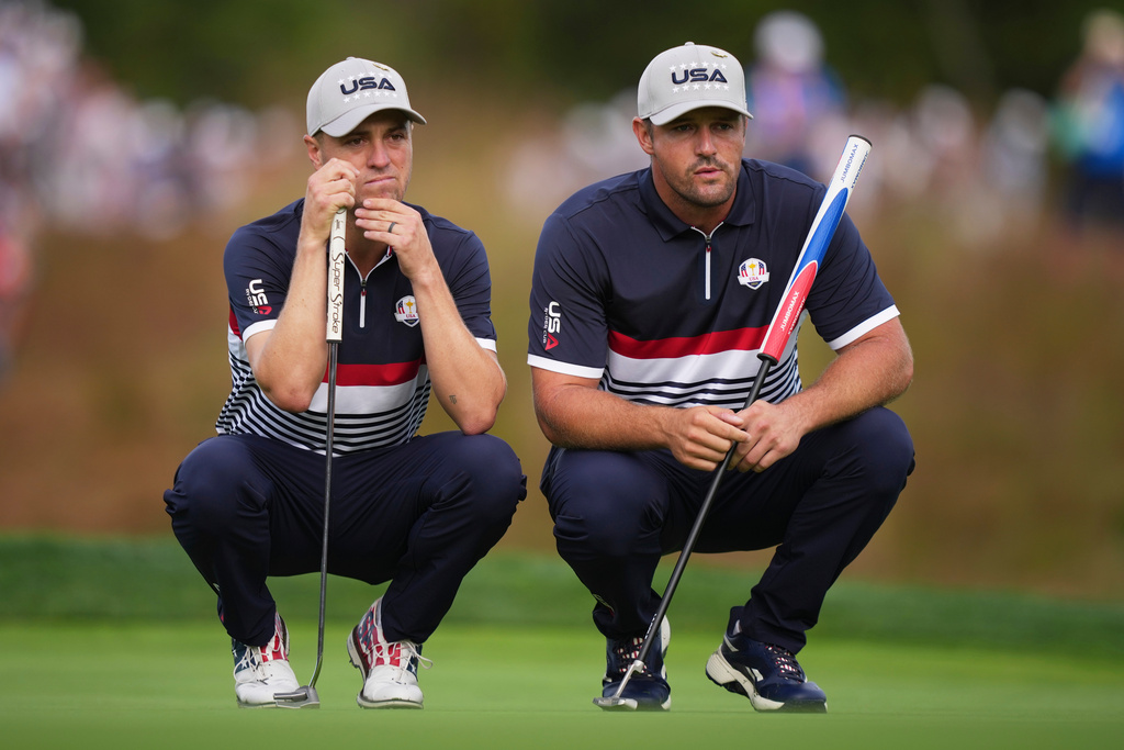 United States' and Justin Thomas and Bryson DeChambeau line up a putt on the 11th hole at Bethpage Black golf course during the Ryder Cup golf tournament, Friday, Sept. 26, 2025, in Farmingdale, N.Y. (AP Photo/Matt Slocum)