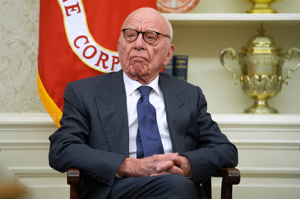 FILE - Rupert Murdoch sits in the Oval Office of the White House as President Donald Trump signs an executive order, Feb. 3, 2025, in Washington. (AP Photo/Evan Vucci, File)