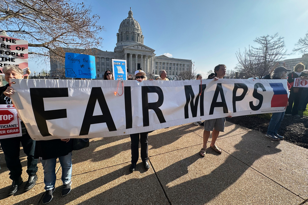 FILE - People opposed to new the U.S. House districts passed by the Missouri General Assembly demonstrate outside the state Capitol in Jefferson City, Mo., on March 10, 2026. (AP Photo/David A. Lieb, File)