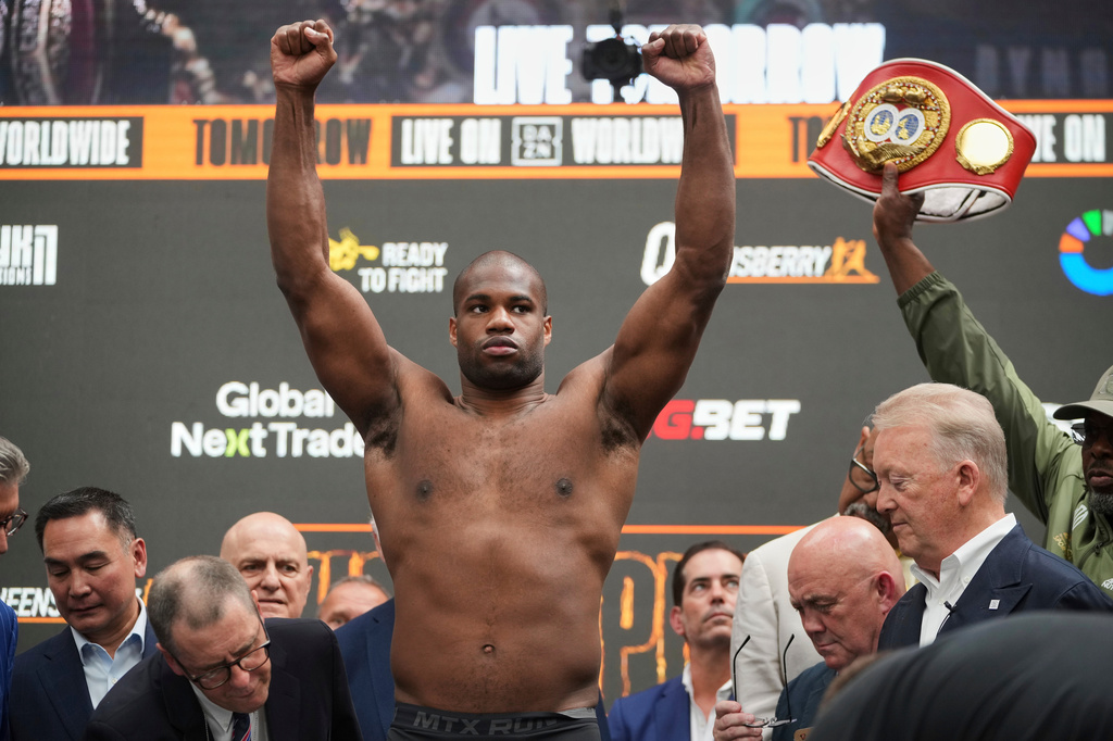 FILE - Britain's Daniel Dubois gestures during the weigh-in, July 18, 2025, in London, ahead of his world heavyweight boxing title fight against Ukraine's Oleksandr Usyk. (AP Photo/Kin Cheung, File)