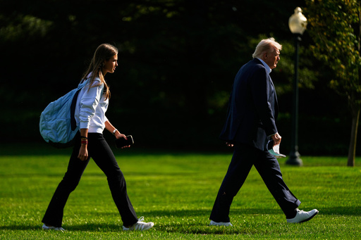 FILE - President Donald Trump, right, arrives with his granddaughter Kai Trump at the White House, Friday, Sept. 26, 2025, in Washington. (AP Photo/Julia Demaree Nikhinson, file) FILE - President Donald Trump, right, arrives with his granddaughter Kai Trump at the White House, Friday, Sept. 26, 2025, in Washington. (AP Photo/Julia Demaree Nikhinson, file)