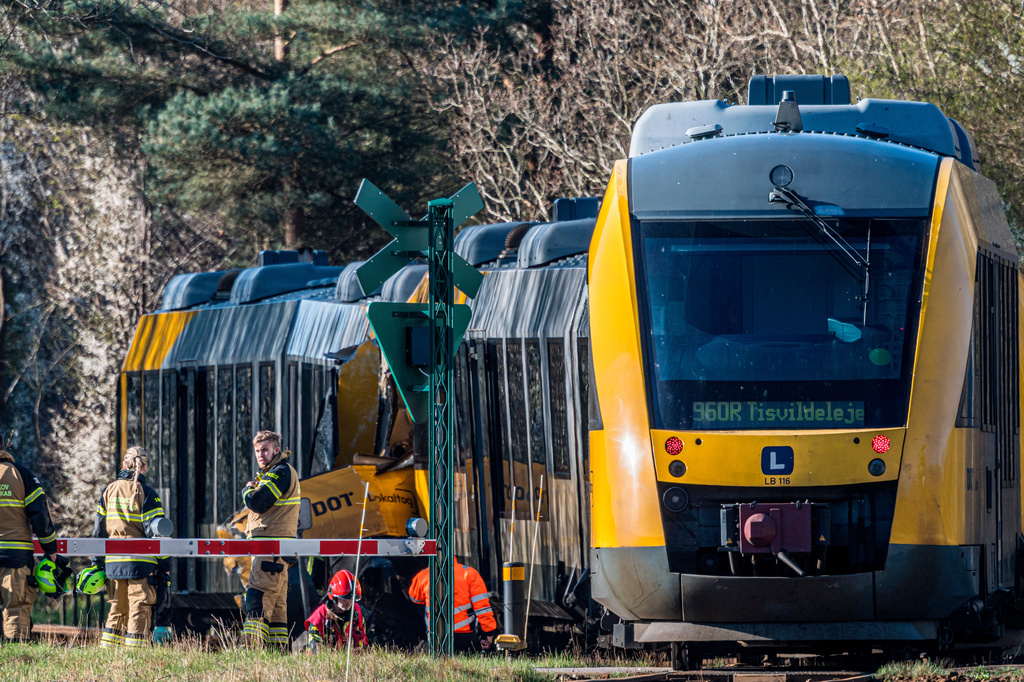 Rescuers at the site where two trains have collided between Hilleroed and Kagerup, north of Copenhagen, Thursday, April 23, 2026. (Steven Knap/Ritzau Scanpix via AP)
