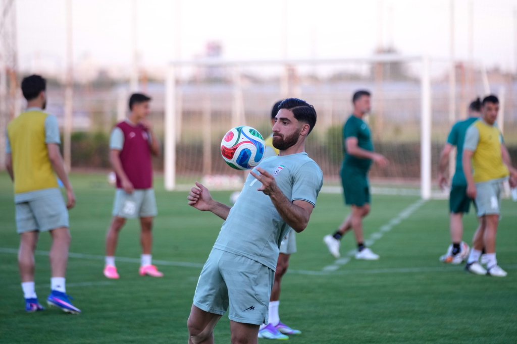 Iran's Alireza Jahanbakhsh works out with teammates during a training session, in Antalya, southern Turkey, Tuesday, June 2, 2026, ahead of the World Cup soccer tournament. (AP Photo/Khalil Hamra)