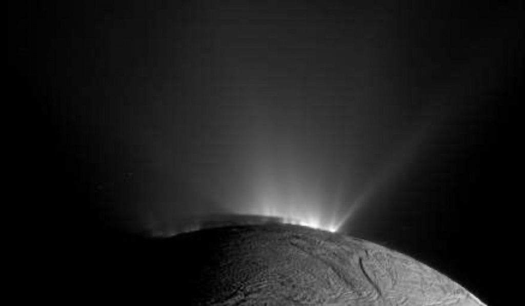 In this image provided by NASA, NASA’s Cassini spacecraft captured this image of Enceladus on Nov. 30, 2010, with the shadow of the body of Enceladus on the lower portions of the jets is clearly visible. (NASA/JPL-Caltech/Space Science Institute via AP)