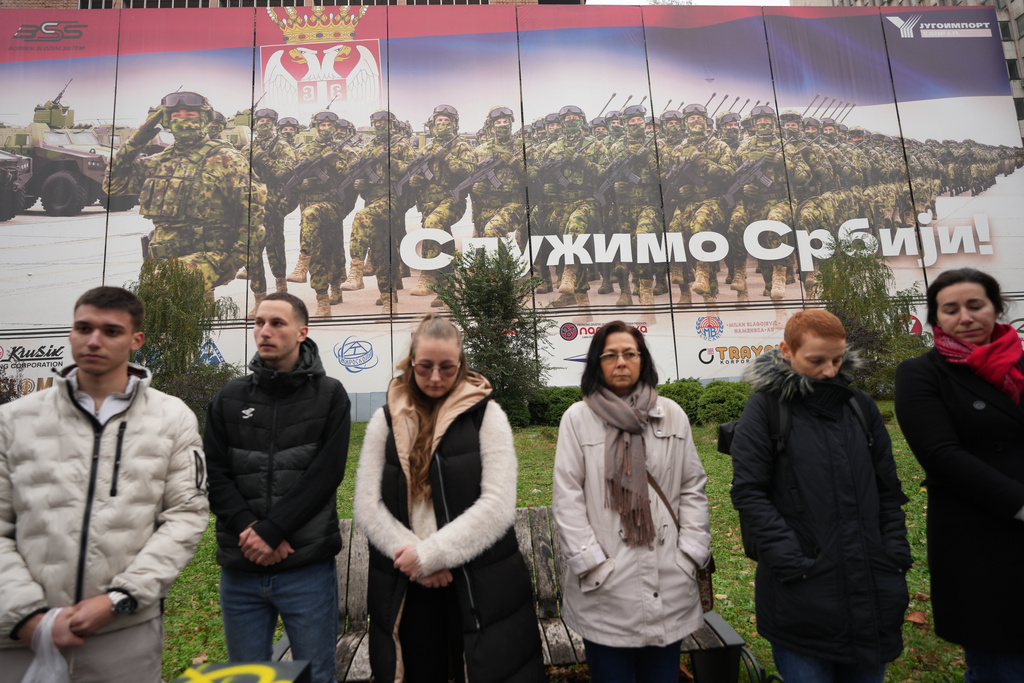 Led by university students, people attend a protest in front of a military complex that was partially destroyed in a NATO bombing campaign in 1999, after Serbian lawmakers on Friday passed a special law clearing the way for a controversial real estate project that would be financed by an investment company linked to President Trump's son-in-law Jared Kushner in Belgrade, Serbia, Tuesday, Nov. 11, 2025. (AP Photo/Darko Vojinovic)