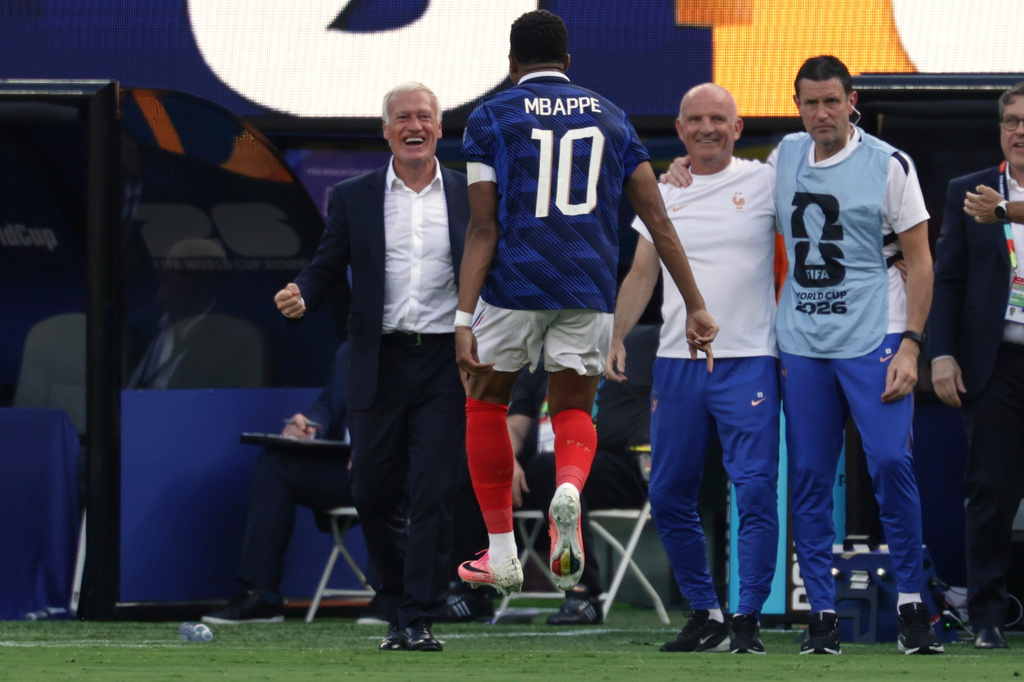 France head coach Didier Deschamps, left, celebrates their first goal with Kylian Mbappe (10) during the World Cup round of 32 soccer match between France and Sweden in East Rutherford, N.J., near New York, Tuesday, June 30, 2026. (AP Photo/Adam Hunger)