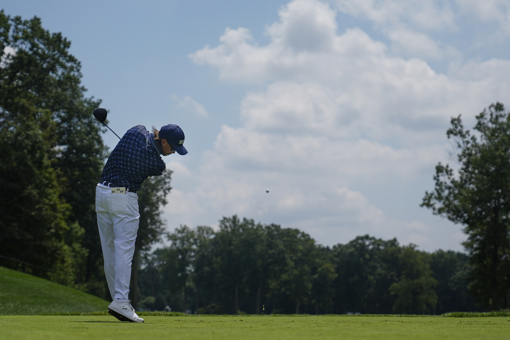 Rickie Fowler hits front the fourth tee during the third round of the BMW Championship golf tournament Saturday, Aug. 16, 2025, in Owings Mills, Md. (AP Photo/Stephanie Scarbrough)