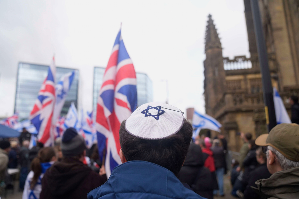 People attend a protest outside Manchester Cathedral following an attack at Heaton Park Hebrew Congregation synagogue in Crumpsall, where two people died, in Manchester, England, Sunday Oct. 5, 2025. (Danny Lawson/PA via AP)