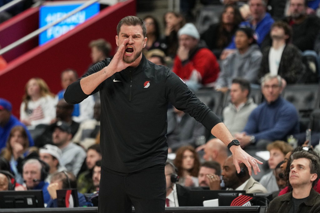 Portland Trail Blazers interim head coach Tiago Splitter reacts during the first half of an NBA basketball game against the Detroit Pistons, Friday, Dec. 5, 2025, in Detroit. (AP Photo/Ryan Sun)