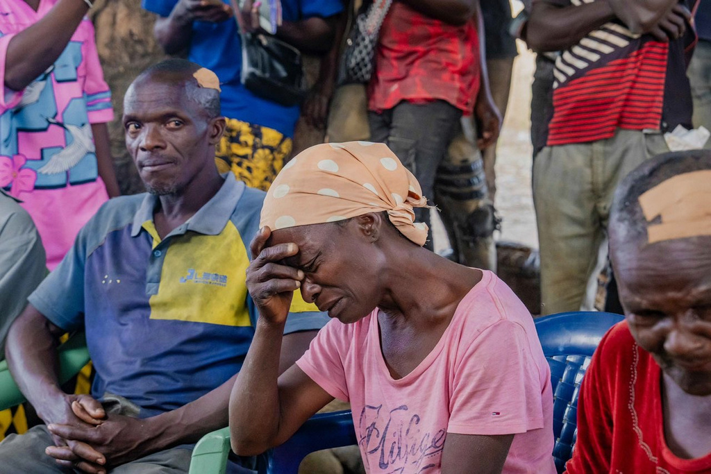 In this photo released by the Kaduna State government, people react during a meeting with Kaduna state Governor. Uba Sani, after gunmen attack in Kurmin Wali, northwest Nigeria, Wednesday, Jan. 21, 2026. (Kaduna State Government via AP)
