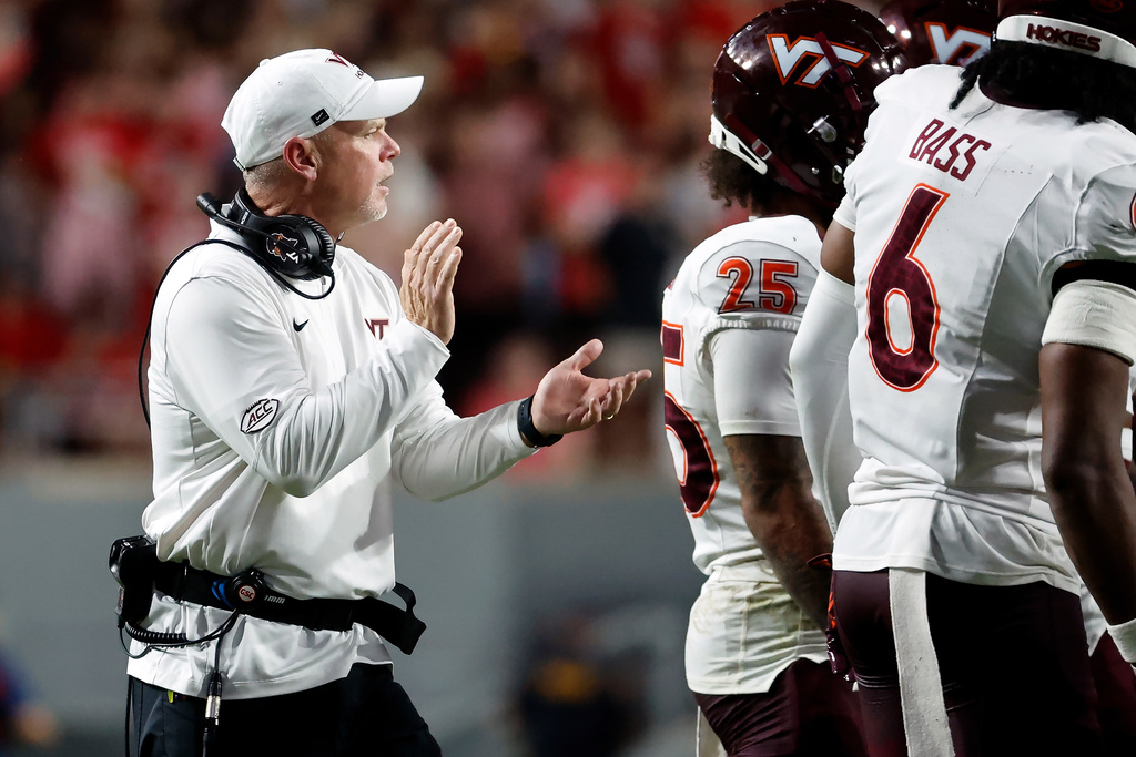 Virginia Tech interim head coach Philip Montgomery watches from the sideline against North Carolina State during the first half of an NCAA college football game in Raleigh, N.C., Saturday, Sept. 27, 2025. (AP Photo/Karl DeBlaker)