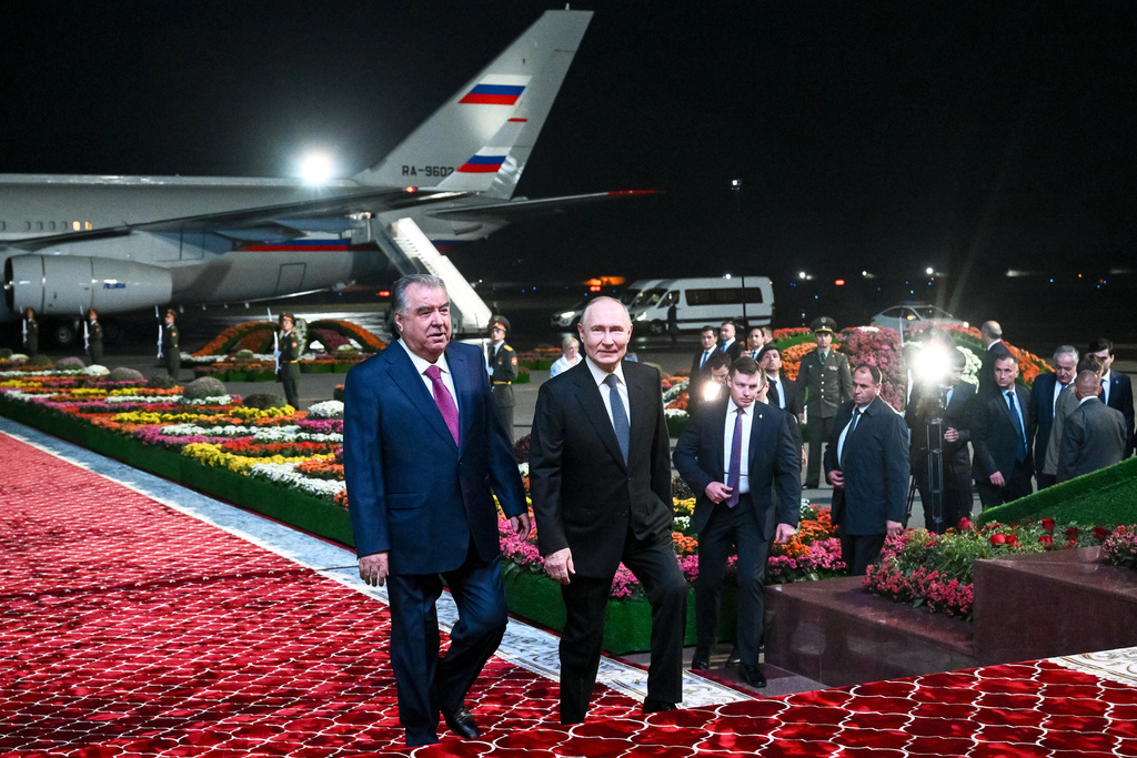 Russian President Vladimir Putin, right, is greeted by Tajik President Emomali Rahmon upon his arrival in Dushanbe, Tajikistan, Wednesday, Oct. 8, 2025. (Kristina Kormilitsyna, Sputnik, Kremlin Pool Photo via AP)