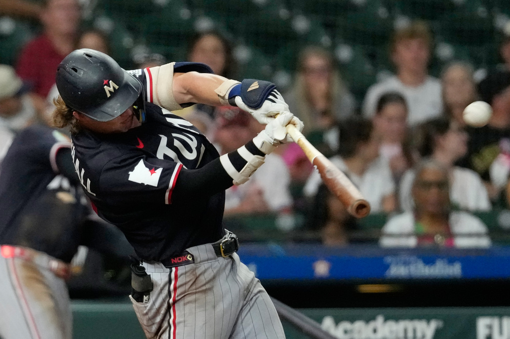 Minnesota Twins' Luke Keaschall hits a home run against the Houston Astros during the eighth inning of a baseball game Wednesday, July 1, 2026, in Houston. (AP Photo/David J. Phillip)