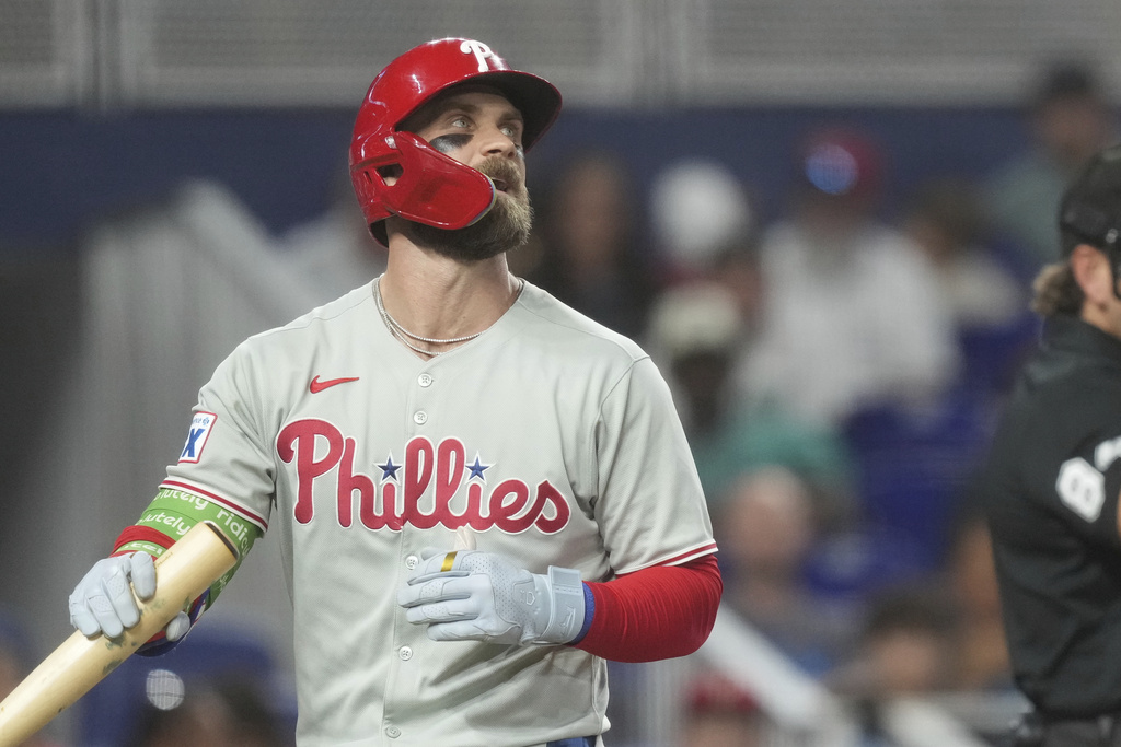 Philadelphia Phillies' J.T. Realmuto reacts after striking out during the third inning of a baseball game against the Miami MarlinsSaturday, Sept. 6, 2025, in Miami. (AP Photo/Marta Lavandier)