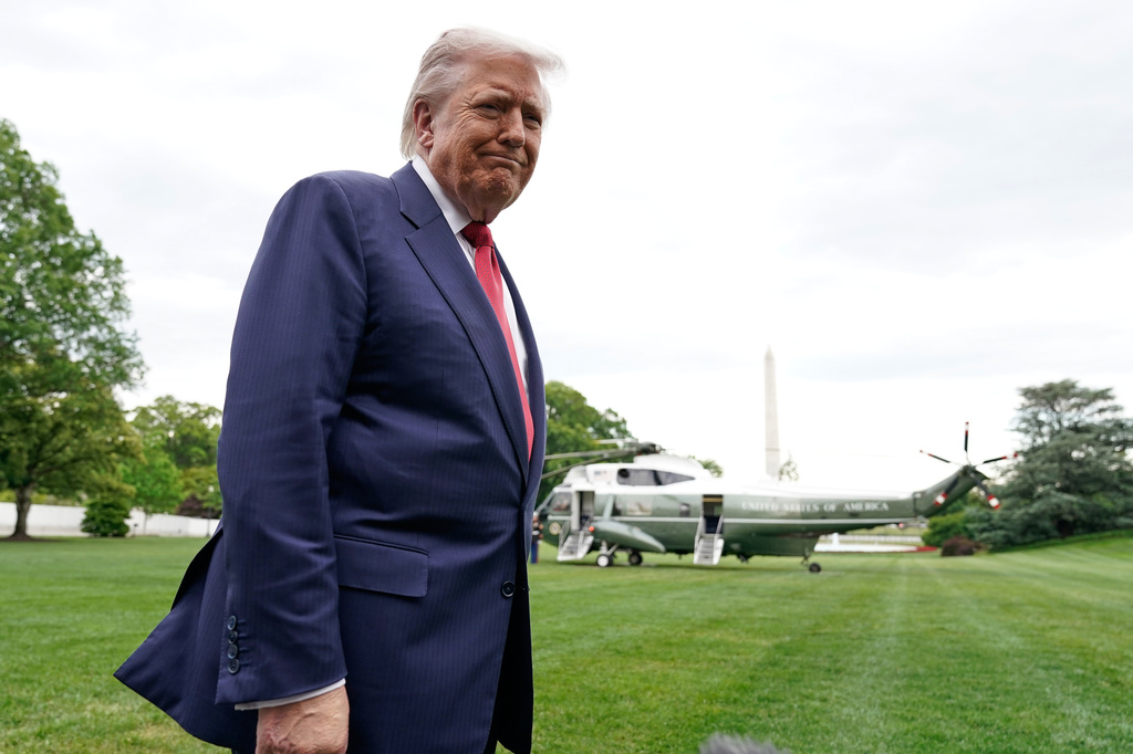 President Donald Trump speaks to reporters as he walks to board Marine One on the South Lawn of the White House, Friday, May 8, 2026, in Washington. (AP Photo/Jose Luis Magana)