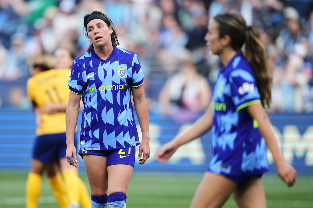 Seattle Reign FC defender Phoebe McClernon reacts after a goal from Utah Royals forward Cloé Lacasse during the first half of an NWSL soccer match, Sunday, April 26, 2026, in Seattle. (AP Photo/Lindsey Wasson)