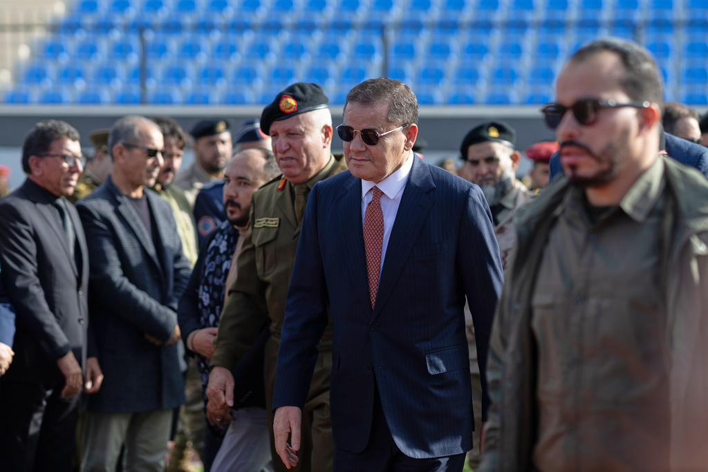 Libyan Prime Minister Abdul Hamid Dbeibah arrives to attend the funeral prayers of Gen. Muhammad Ali Ahmad al-Haddad, in Misrata, Libya, Sunday, Dec. 28, 2025, who was killed with others in a plane crash on Tuesday after taking off from Ankara. (AP Photo/Yousef Murad)
