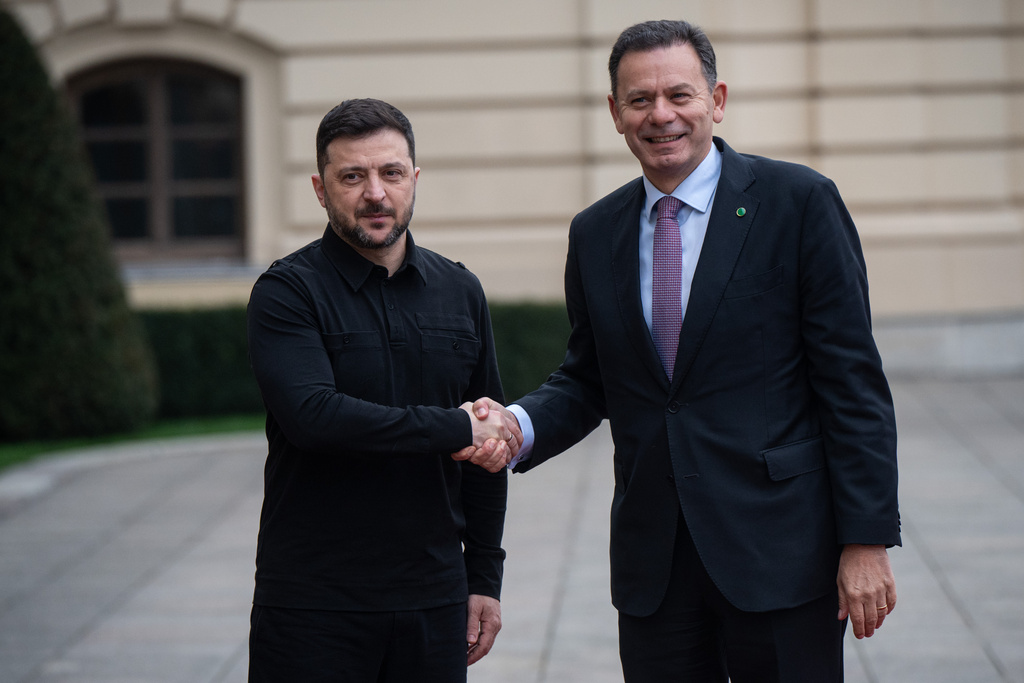 Ukraine's President Volodymyr Zelenskyy, left, shakes hands with Portuguese Prime Minister Luís Montenegro in Kyiv, Ukraine, Saturday, Dec. 20, 2025. (AP Photo/Danylo Antoniuk)