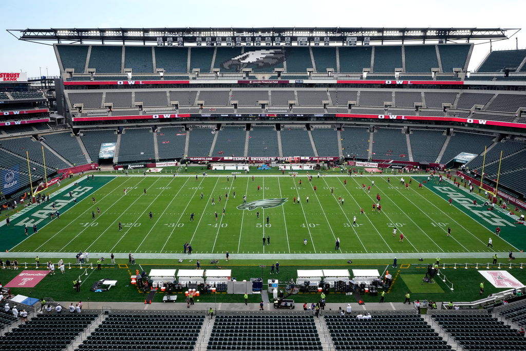 Players warm up before an NCAA college football game between Temple and Penn State Saturday, Sept. 12, 2026, in Philadelphia. (AP Photo/Matt Slocum)