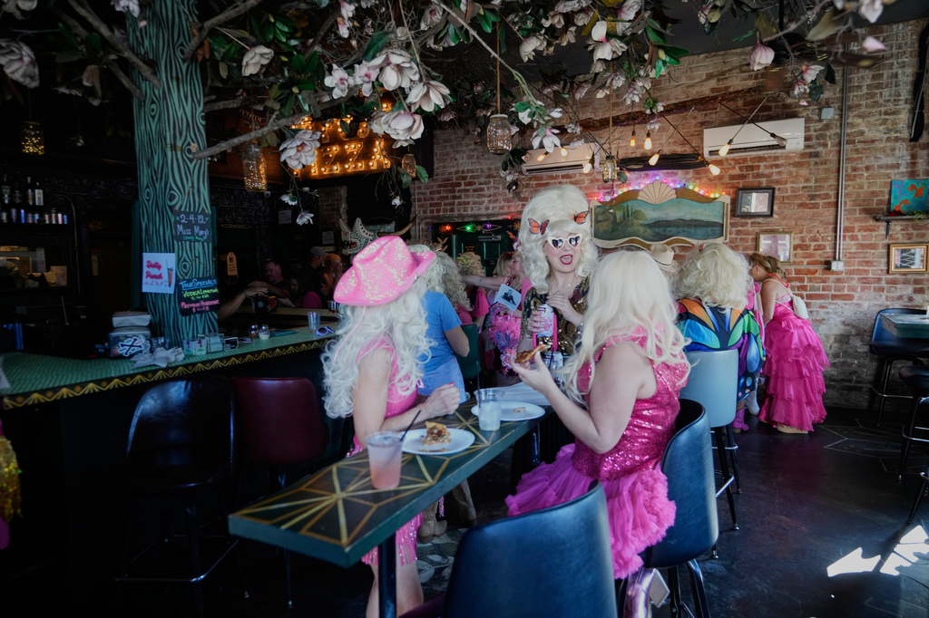 Participants in the Krewe of Dolly tribute congregate in the Rampart Treehouse Bar before a second line parade in commemoration of the life of Dolly Parton through the French Quarter Friday, Sept. 25, 2026, in New Orleans. (AP Photo/Gerald Herbert)