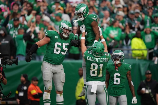 Philadelphia Eagles wide receiver Jahan Dotson (2) celebrates scoring a touchdown with Eagles offensive tackle Lane Johnson (65), Eagles tight end Grant Calcaterra (81) and Eagles wide receiver Devonta Smith (6) during the second half of an NFL football game against the New York Giants on Sunday, Oct. 26, 2025, in Philadelphia. (AP Photo/Matt Slocum) Philadelphia Eagles wide receiver Jahan Dotson (2) celebrates scoring a touchdown with Eagles offensive tackle Lane Johnson (65), Eagles tight end Grant Calcaterra (81) and Eagles wide receiver Devonta Smith (6) during the second half of an NFL football game against the New York Giants on Sunday, Oct. 26, 2025, in Philadelphia. (AP Photo/Matt Slocum)