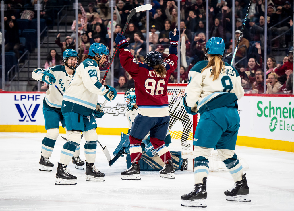 Montreal Victoire's Natalie Mlynkova (96) celebrates after scoring on Seattle Torrent goaltender Hannah Murphy (83), during the second period of a PWHL hockey gamen in Laval, Que., on Tuesday, April 7, 2026. (Christopher Katsarov/The Canadian Press via AP)
